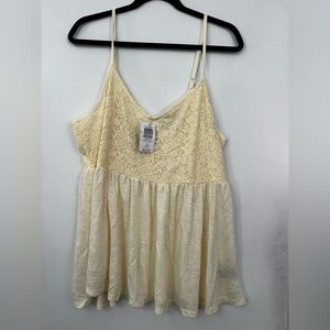 Light yellow tank top with tags. Torrid size 2